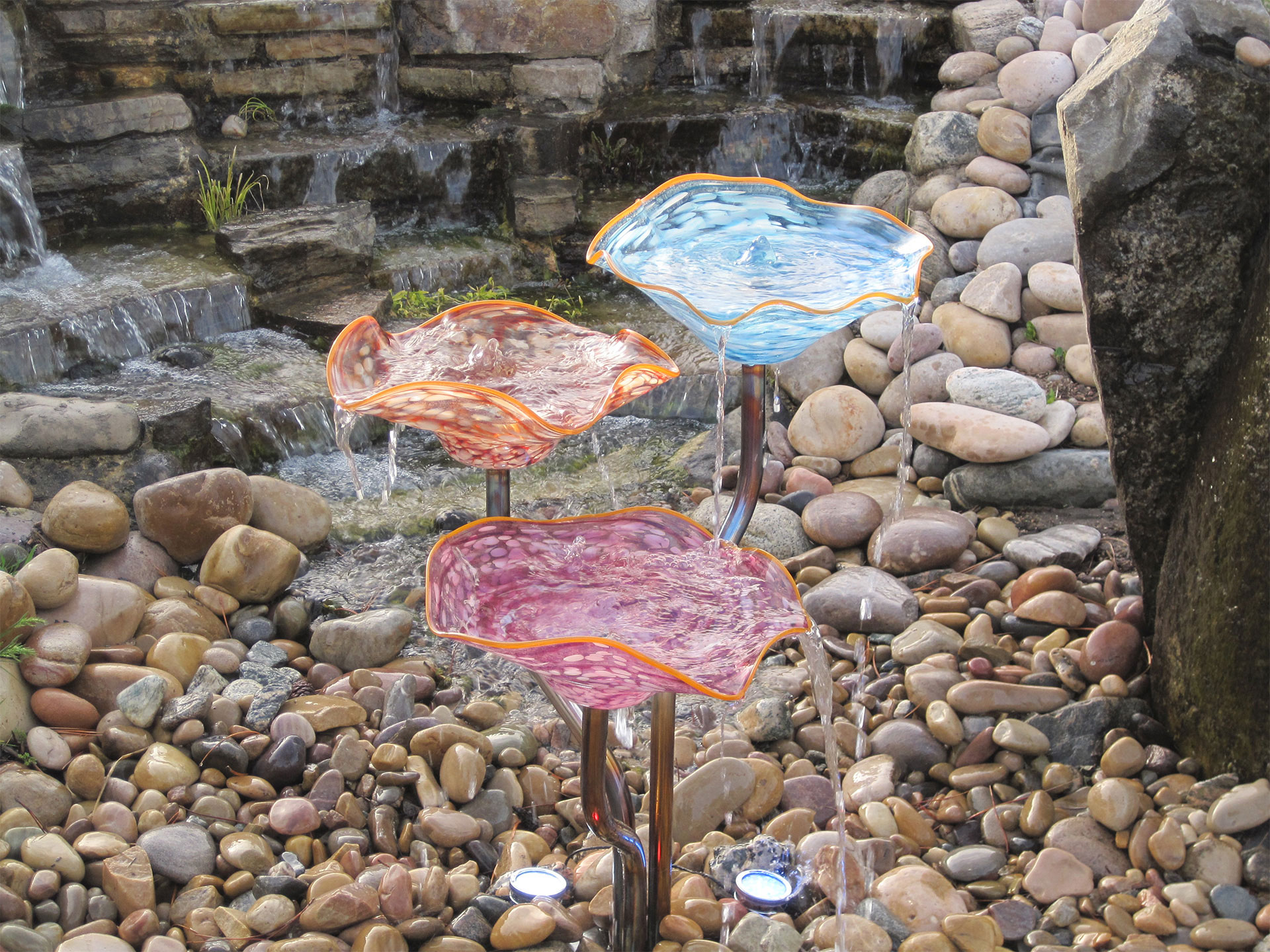 Colorful outdoor fountain shaped like glass flowers